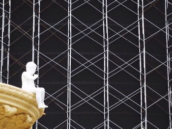 Low angle view of statue against building