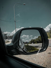 Reflection of road on side-view mirror