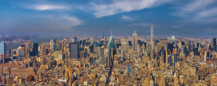 Aerial view of cityscape against sky