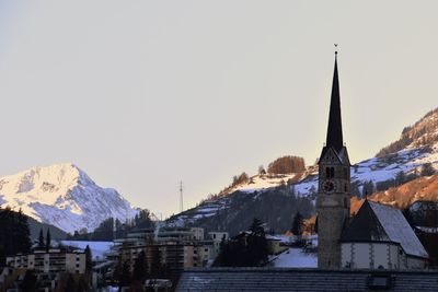 Panoramic view of church against sky during winter