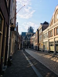 Narrow street amidst buildings in town