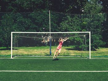 Man playing soccer on field