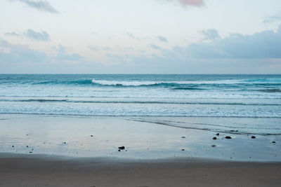 Scenic view of beach against sky