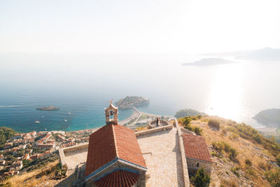 High angle view of building by sea against sky