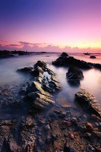 Scenic view of sea against sky at sunset