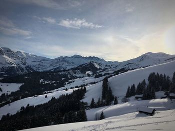 Scenic view of snowcapped mountains against sky