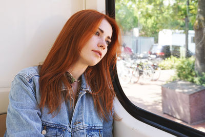 Portrait of young woman looking away