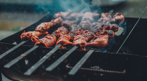 Close-up of meat on barbecue grill