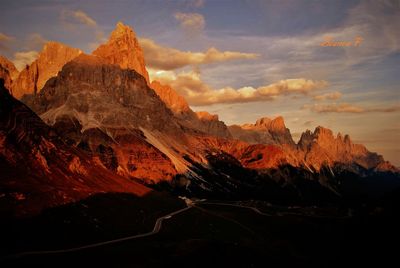 Scenic view of rocky mountains against sky during sunset