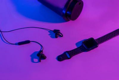 High angle view of telephone booth on table against blue background