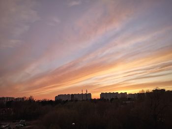 Buildings against sky during sunset