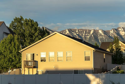 Houses against sky in city