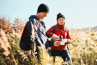 Couple relaxing and enjoying the coffee during vacation trip. active leisure time close to nature