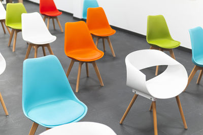 High angle view of empty chairs and table in restaurant