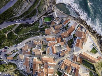 High angle view of townscape by sea