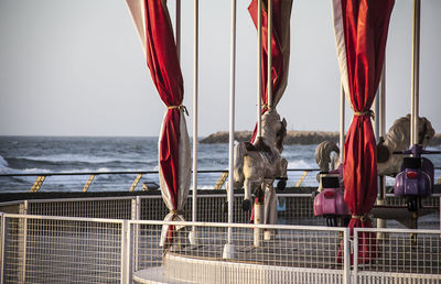 Fishing boats in sea against sky