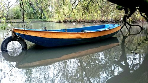 Scenic view of river with trees in background