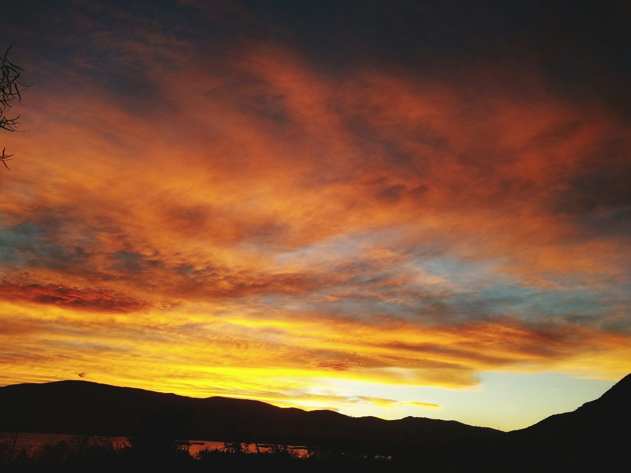 sunset, silhouette, sky, scenics, beauty in nature, orange color, tranquil scene, cloud - sky, tranquility, dramatic sky, idyllic, nature, cloud, cloudy, landscape, moody sky, majestic, mountain, atmospheric mood, outdoors