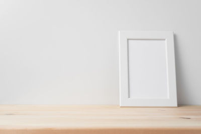 White wooden table against wall at home