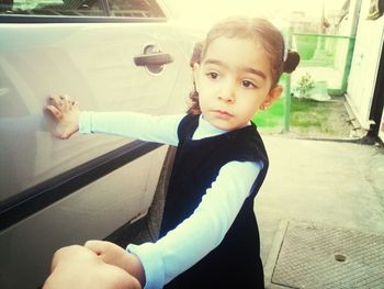 Portrait of cute boy in car