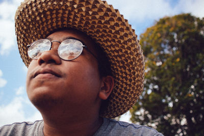 Close-up portrait of man wearing hat