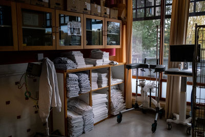 Empty chairs and tables in bed by window at home