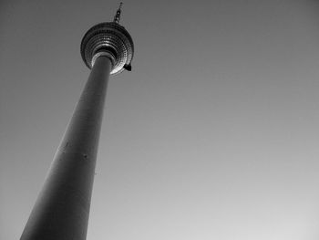 Low angle view of communications tower against sky