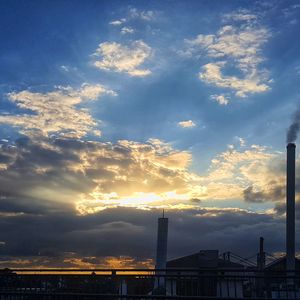 Low angle view of silhouette buildings against sky during sunset