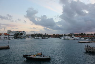 View of boats in sea at sunset