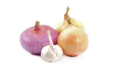 Close-up of eggs against white background
