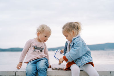 Sisters playing at beach