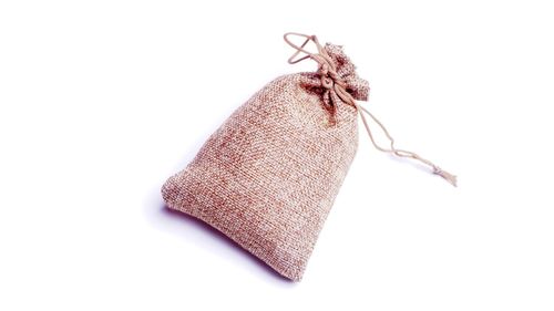 Close-up of rope tied to over white background