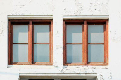 Low angle view of window on old building