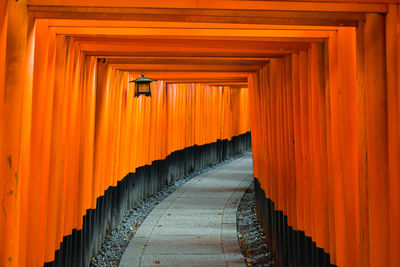 Vermillion gates at the fushimi inari shrine, kyoto, japan