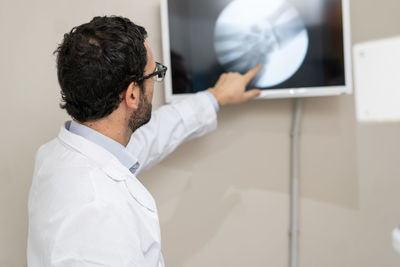 Side view of man using digital tablet