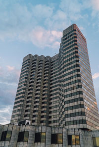 Low angle view of building against cloudy sky