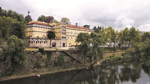 Reflection of antique building in a river