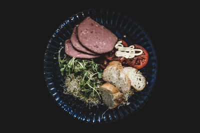 Close-up of food over black background