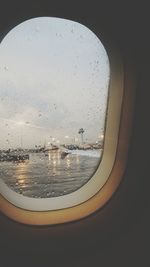 Reflection of sky seen through wet window