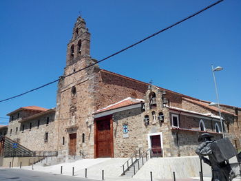 Low angle view of built structure against blue sky