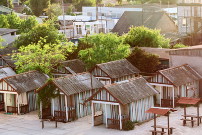 Chairs and tables against buildings in city