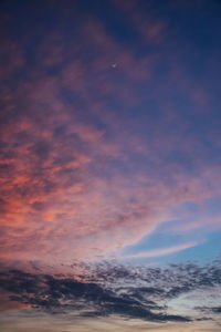 Low angle view of dramatic sky during sunset