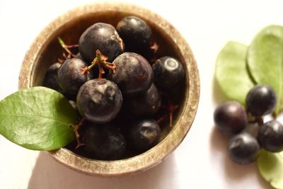 High angle view of grapes in bowl on table