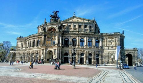 Group of people in front of historical building