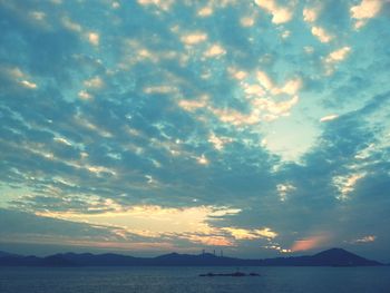 Scenic view of sea against cloudy sky