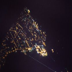 Low angle view of illuminated city at night