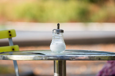 Sugar dispenser on a bistro table outdoors