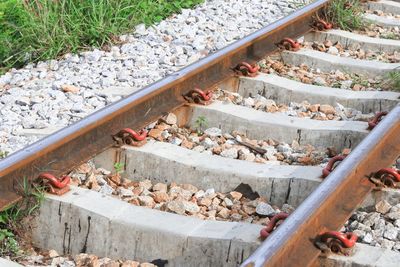 High angle view of stones on railroad track