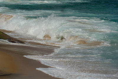 Waves splashing on shore