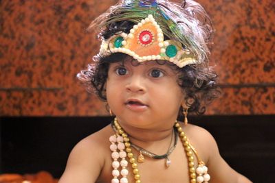 Close-up of baby boy dressed as krishna